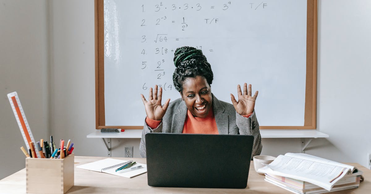 Burushaski teacher or course in Hunza Valley, Pakistan - Happy black woman using laptop for online work