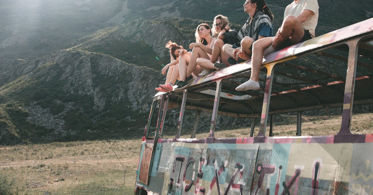 Bus from Gorlitz (Germany) to Zgorzelec (Poland) - Group of people sitting on abandoned bus