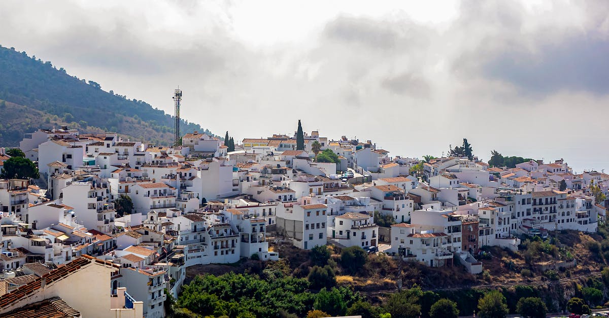 Bus service between small towns in Spain - Amazing scenery of small southern town located in grassy hilly Andalusia region in daylight