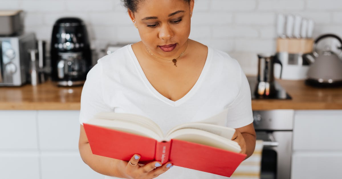 Busiest domestic-only airport? - Woman Holding Book in Kitchen