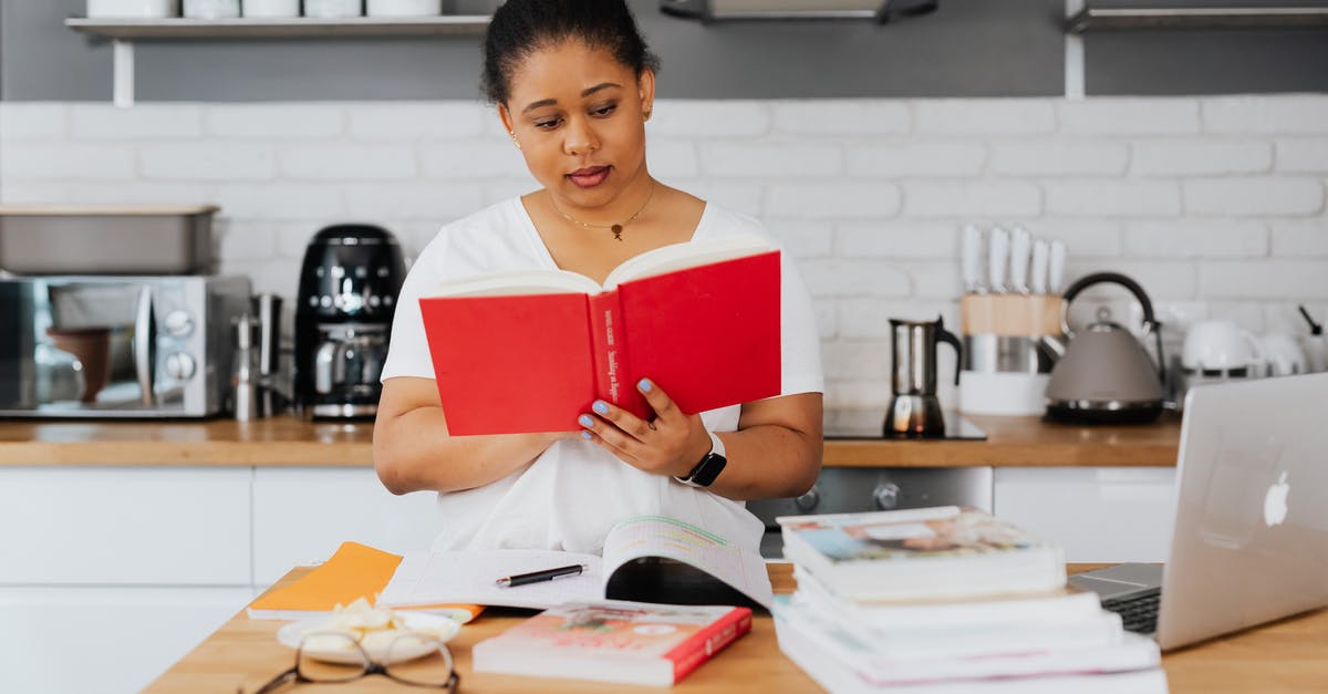 Busiest domestic-only airport? - Woman Reading Book in Kitchen