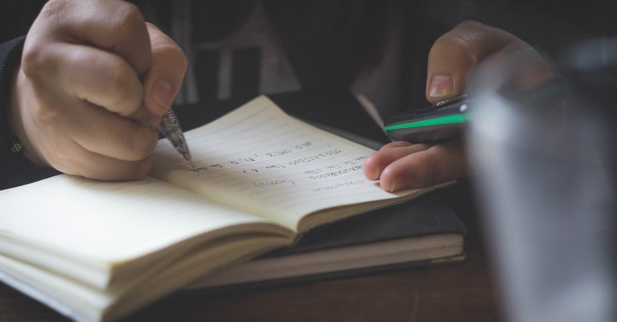 Business class fully booked! - Person Writing While Using Phone