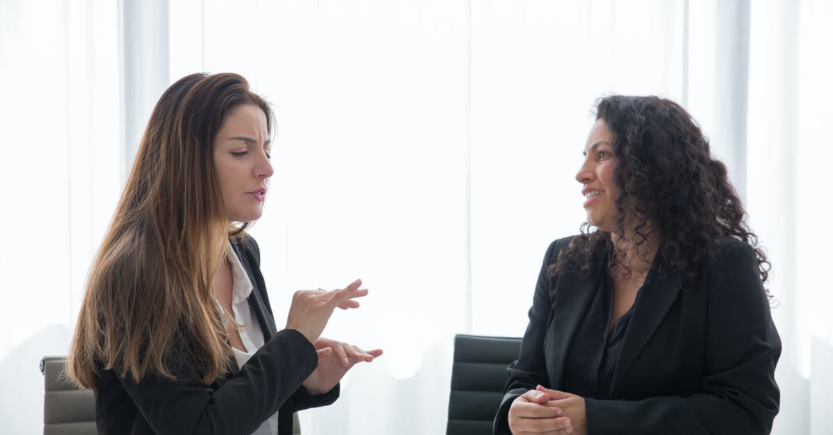 Business Schengen Visa [closed] - Woman in Black Blazer Sitting at the Table