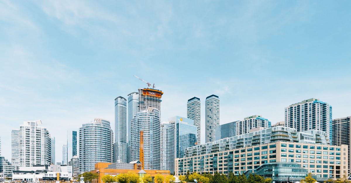 Business travel to Canada - White High Rise Buildings Near Body of Water