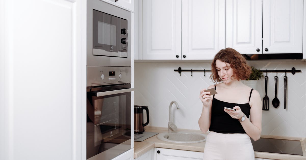 Buying a phone in Europe [closed] - Woman Leaning on a Kitchen Counter