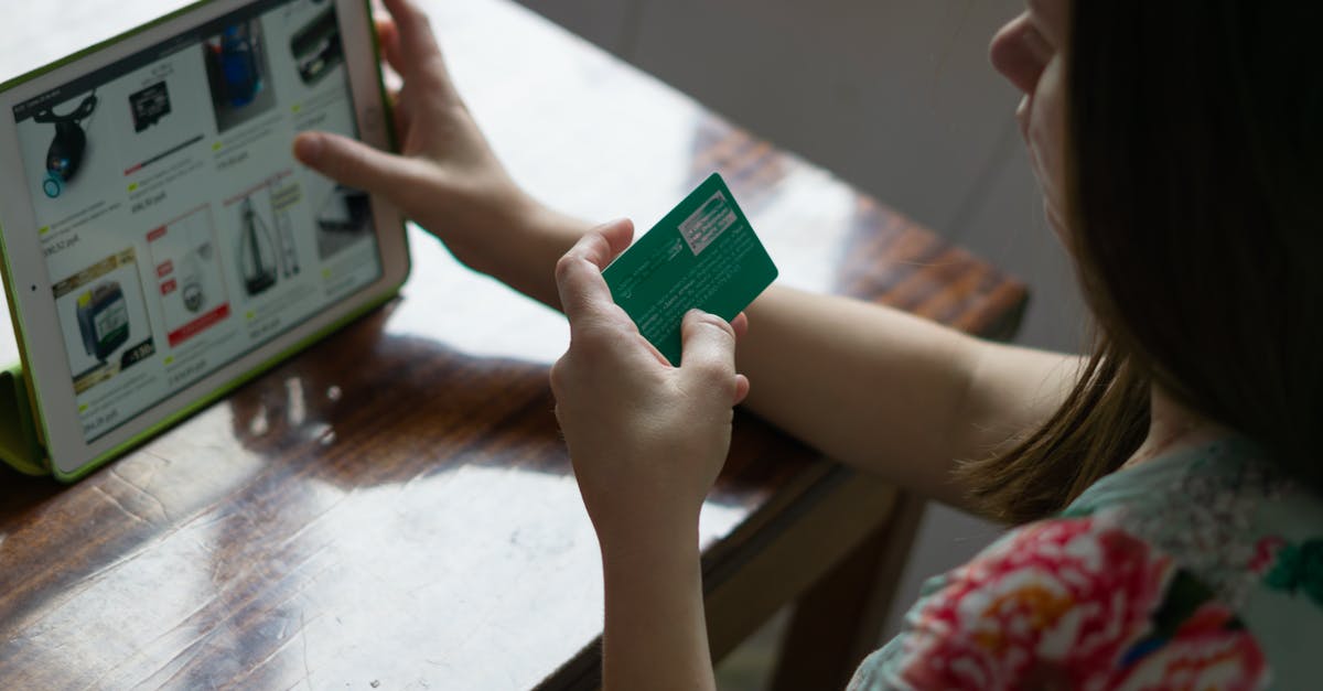 Buying a sim-card for a week in Russia [duplicate] - Person Holding Green and White Card