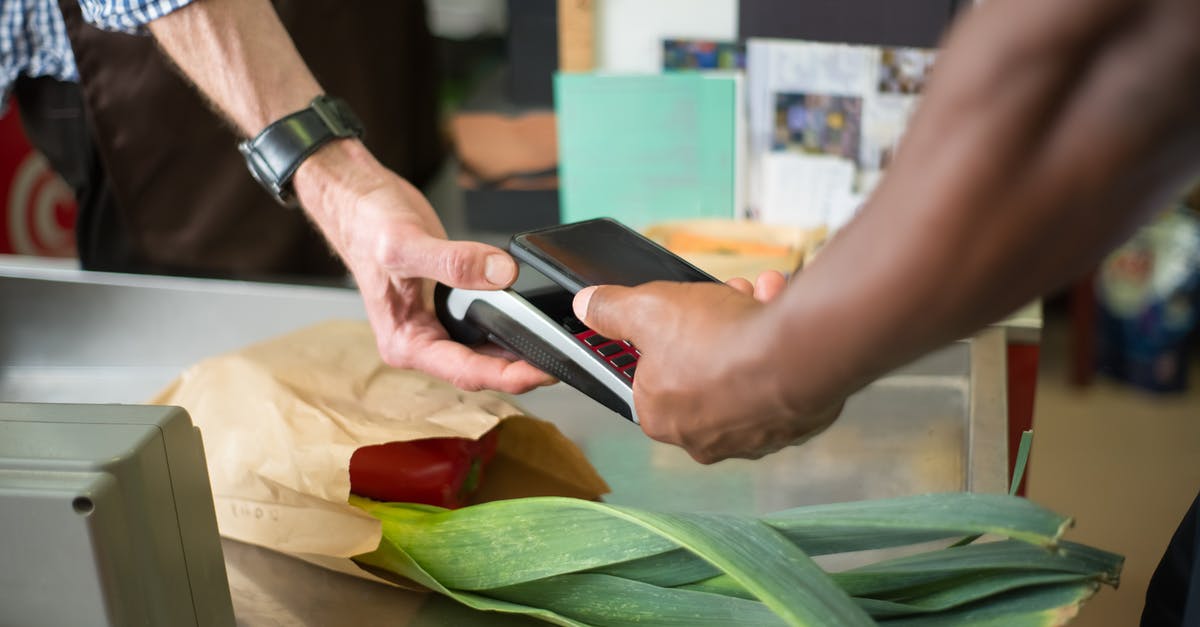 Buying goods online from Canada to EU is VAT free? [closed] - A Customer Paying for Groceries Using a Smartphone