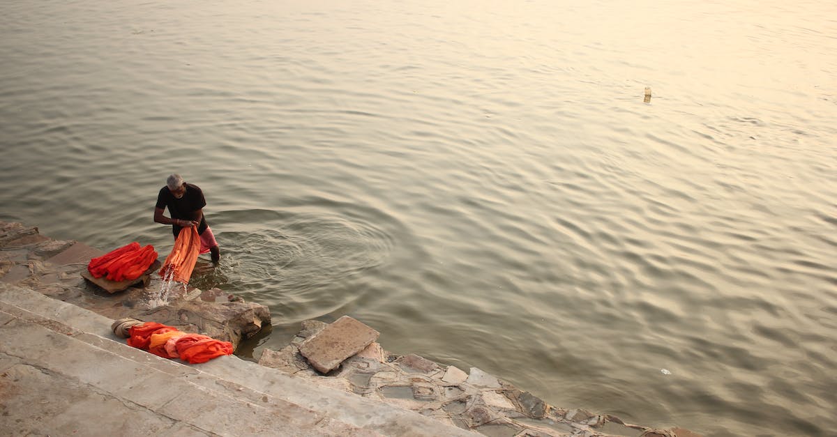 Buying tailor-made clothes while in India - Man on Body of Water