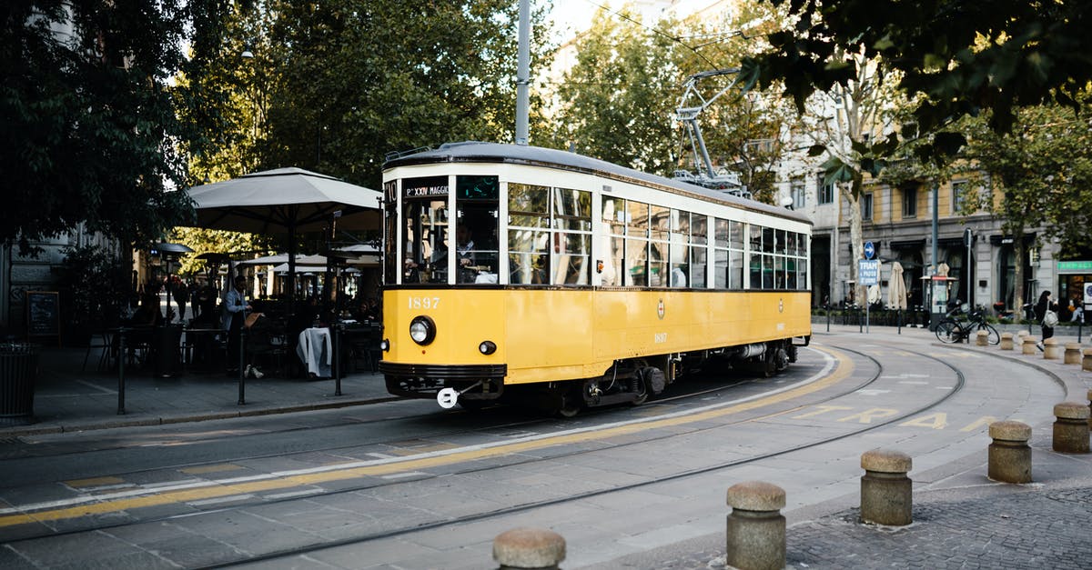 Buying tickets for travelling by train in Italy [closed] - Yellow and White Tram on Road