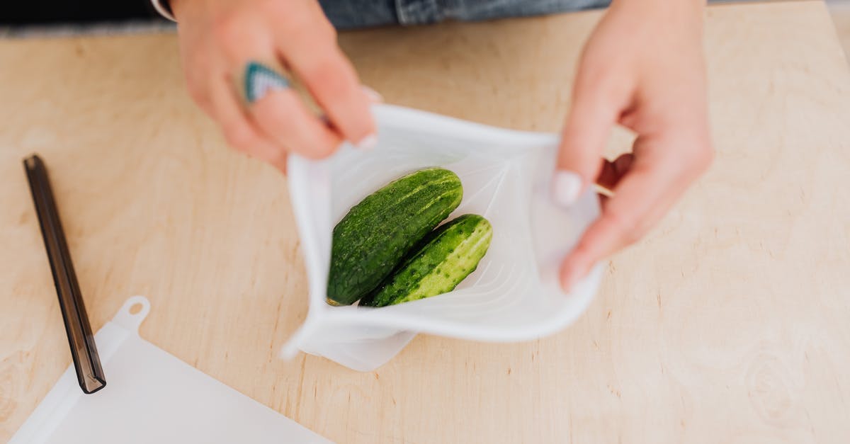 Cabin bag total linear length is 125 [closed] - Hands Holding Bag with Cucumbers