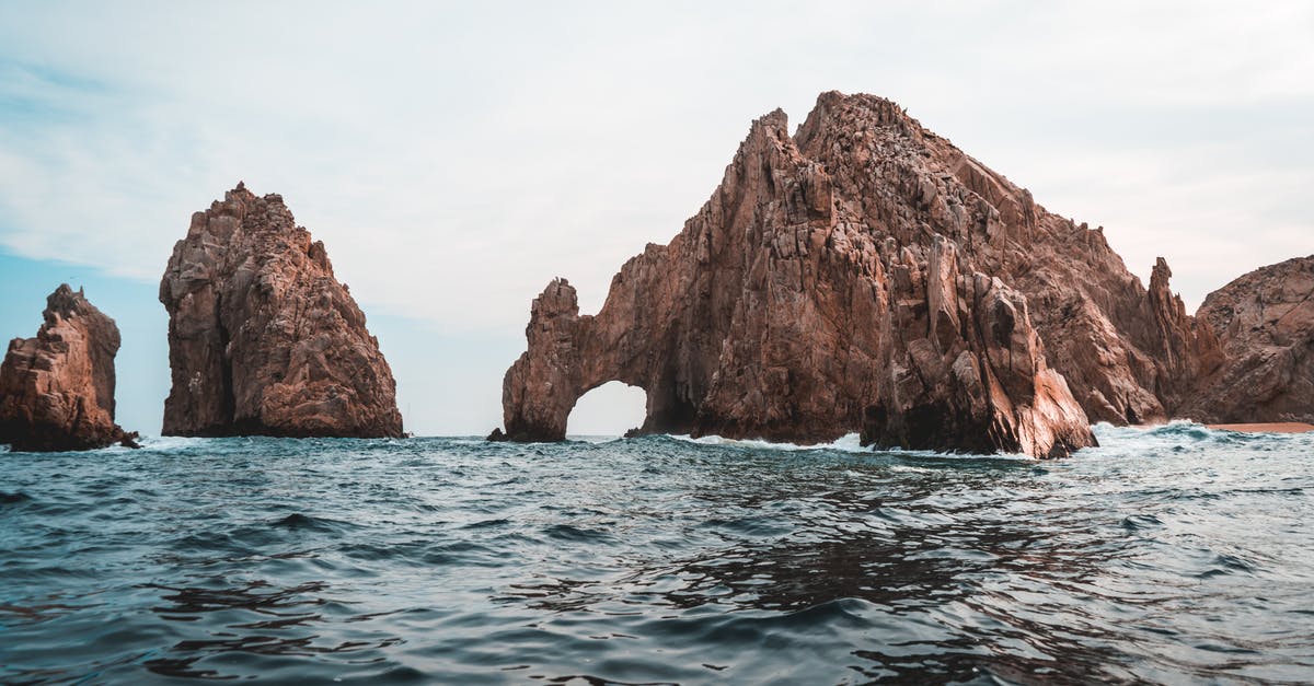 Cabo San Lucas Water Taxi - El Arco De Cabo San Lucas Under White and Blue Sky