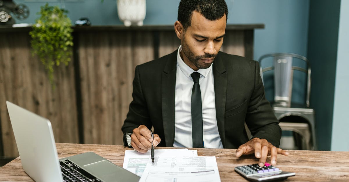 Calculating Schengen visa validity - Man in Black Suit Working