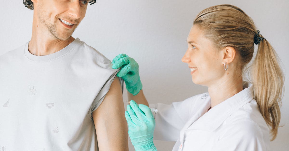 California Covid-19 vaccination for non-resident non-citizen - Woman in White Uniform Giving Man a Vaccine