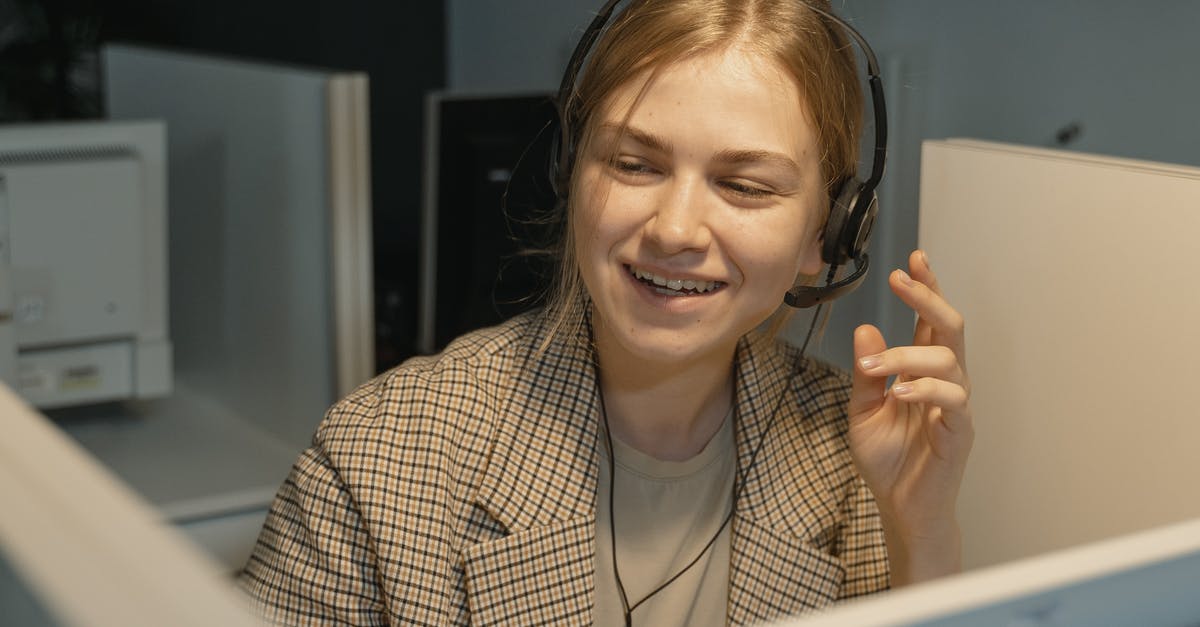 Call for an interview [closed] - Woman in Brown and White Plaid Blazer Wearing Black Headphones