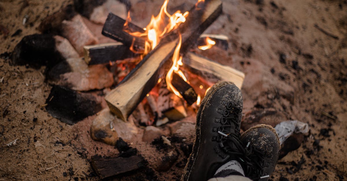 Camping in Oregon during the August 2017 eclipse - Person Wearing Brown Leather Boots Near Bonfire