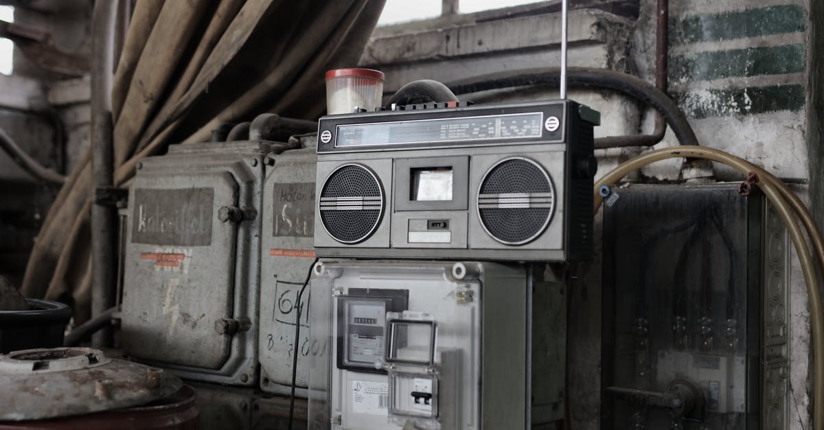Camping/tent facility in Prague - Old fashioned cassette player placed in shabby garage near old industrial equipment