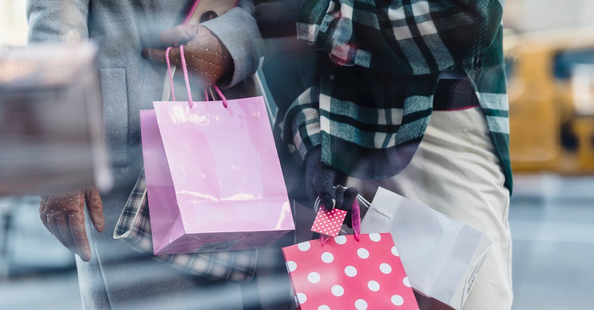 Can't smugglers just walk straight through E.U. customs checks? - Crop faceless women in trendy outerwear carrying paper bags in hands and standing near shop window