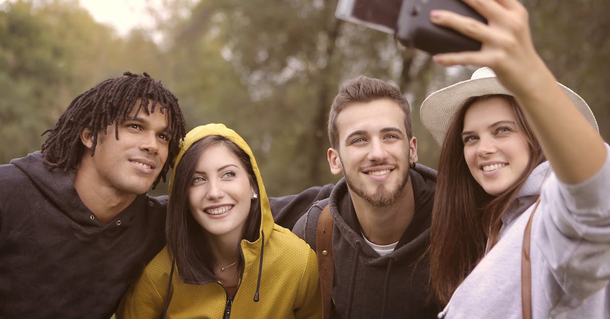 Can a student visa to Australia be changed to a working holiday visa after the course without having to leave the country? - Happy diverse friends taking selfie in park