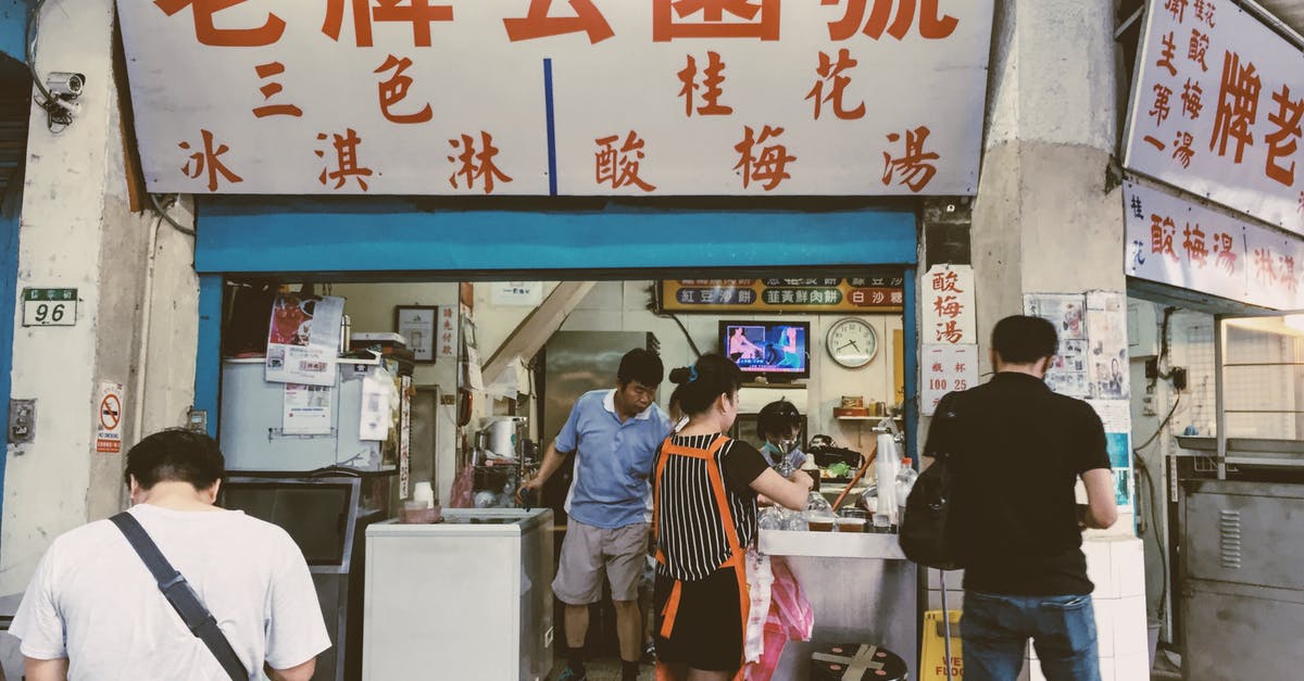 Can a tourist buy a gun in the USA? - Person in Black Shirt Standing in Front of Store