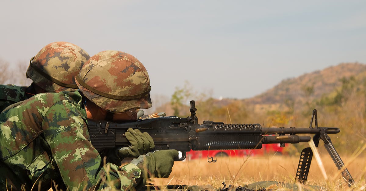 Can a tourist shoot a gun in the USA? - Man Lying Forward Using Rifle at the Field during Day