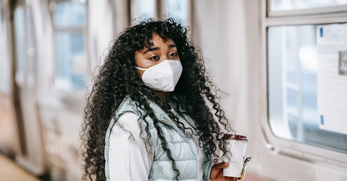 Can a Ukranian citizen with a C1D visa transit two stops within the USA? - Black woman in mask waiting to enter subway train Can a Ukranian citizen with a C1D visa transit two stops within the USA? - Black woman in mask waiting to enter subway train