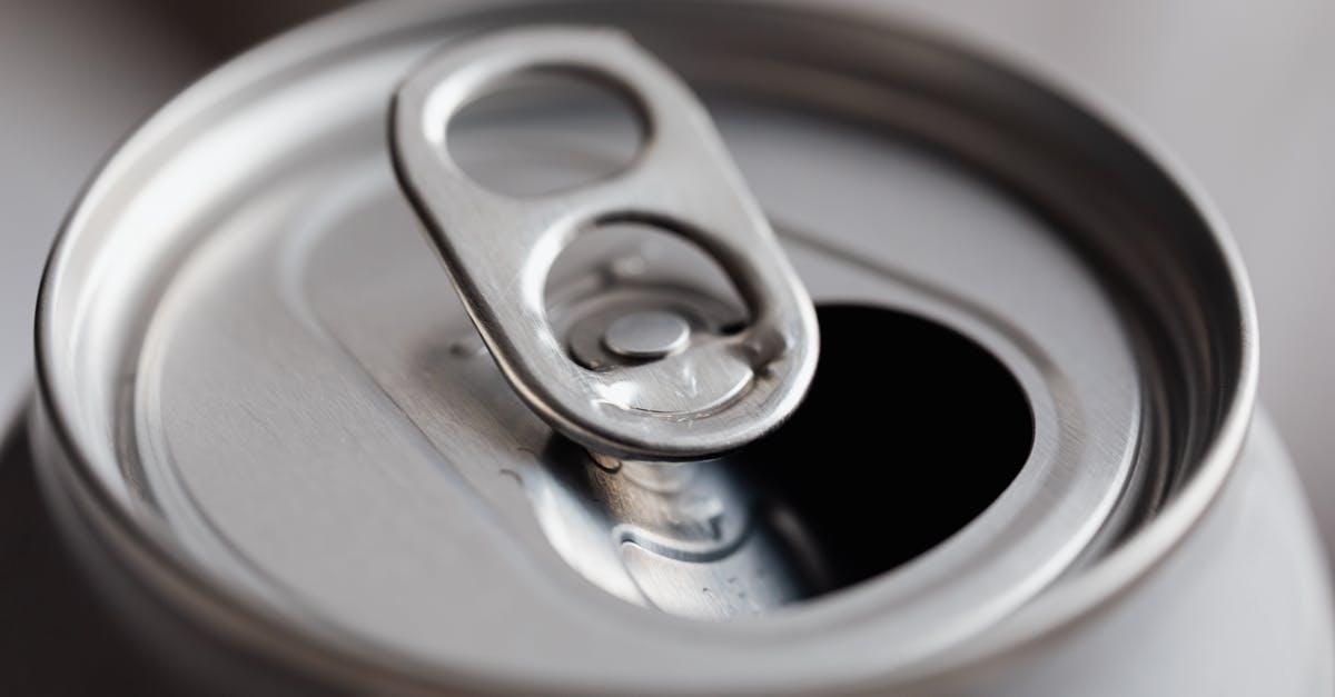 Can airlines open your checked-in luggage without telling you? - Open grey metal soda can