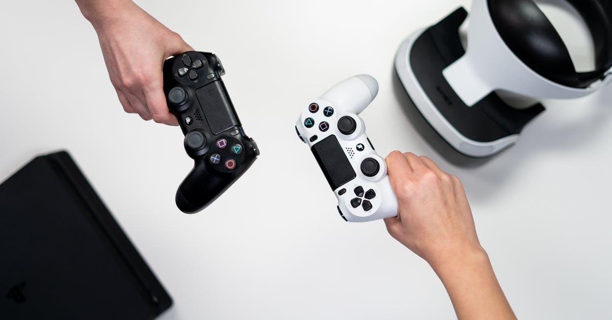 Can Airplane security devices damage games consoles? - Person Holding White and Black Xbox One Game Controller