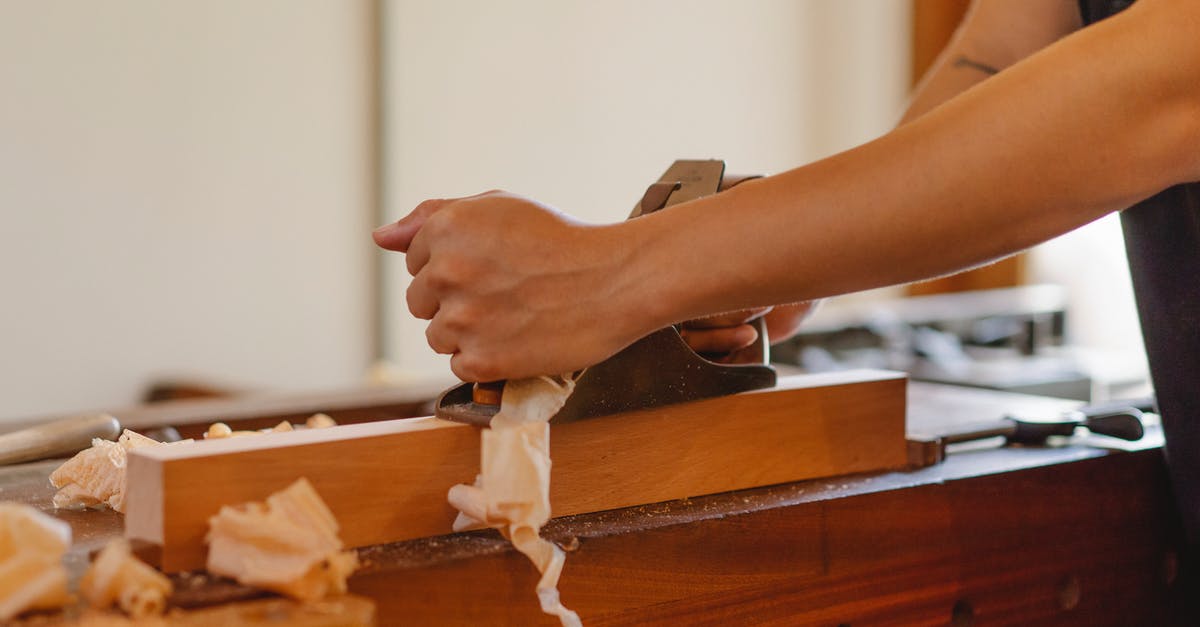 Can board a plane to Cameroon without a Cameroonian visa? - Crop woodworker planing hardwood plank