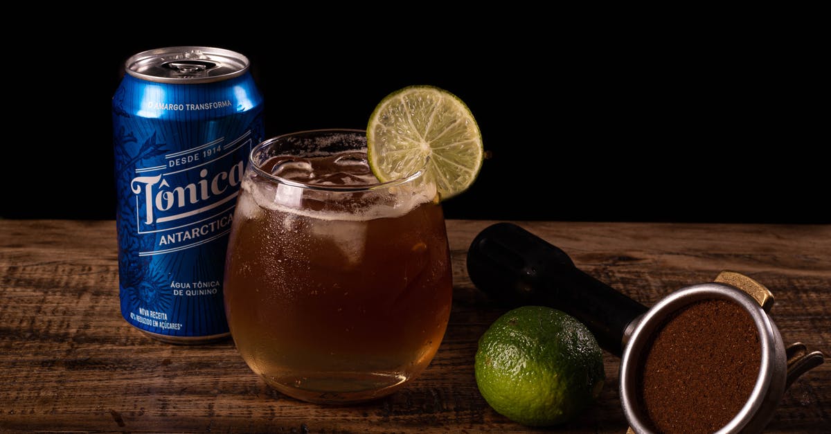 Can delays permit me to taken an earlier train? - Blue and White Labeled Can Beside Clear Drinking Glass With Orange Juice