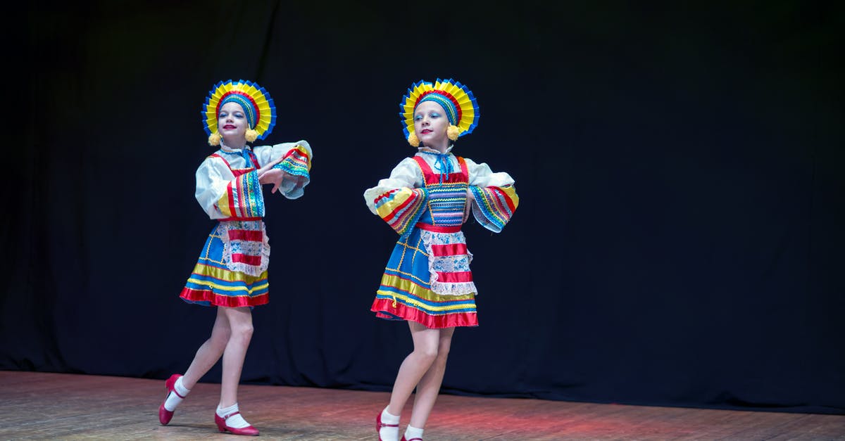 Can foreign tourists see Pakistani dancing girls? - 2 Women in Traditional Dress Standing on Stage