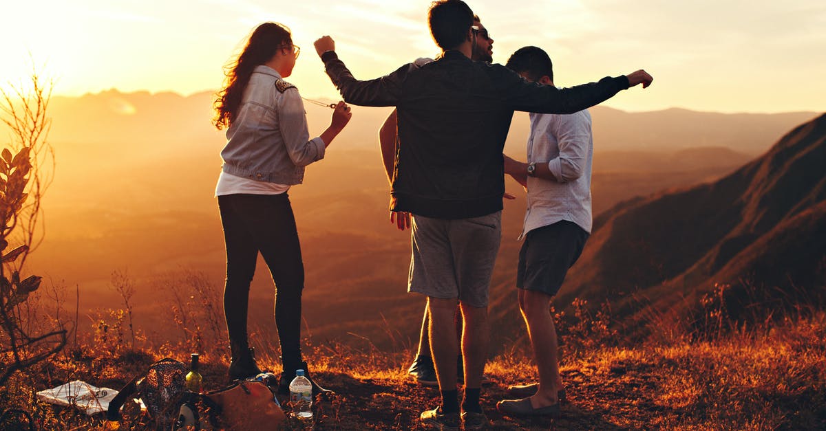 Can foreign tourists see Pakistani dancing girls? - Four Person Standing at Top of Grassy Mountain