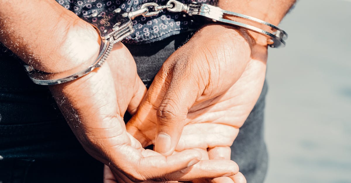 Can go to the UK if I have a criminal record? [closed] - Close Up Photography of Person in Handcuffs