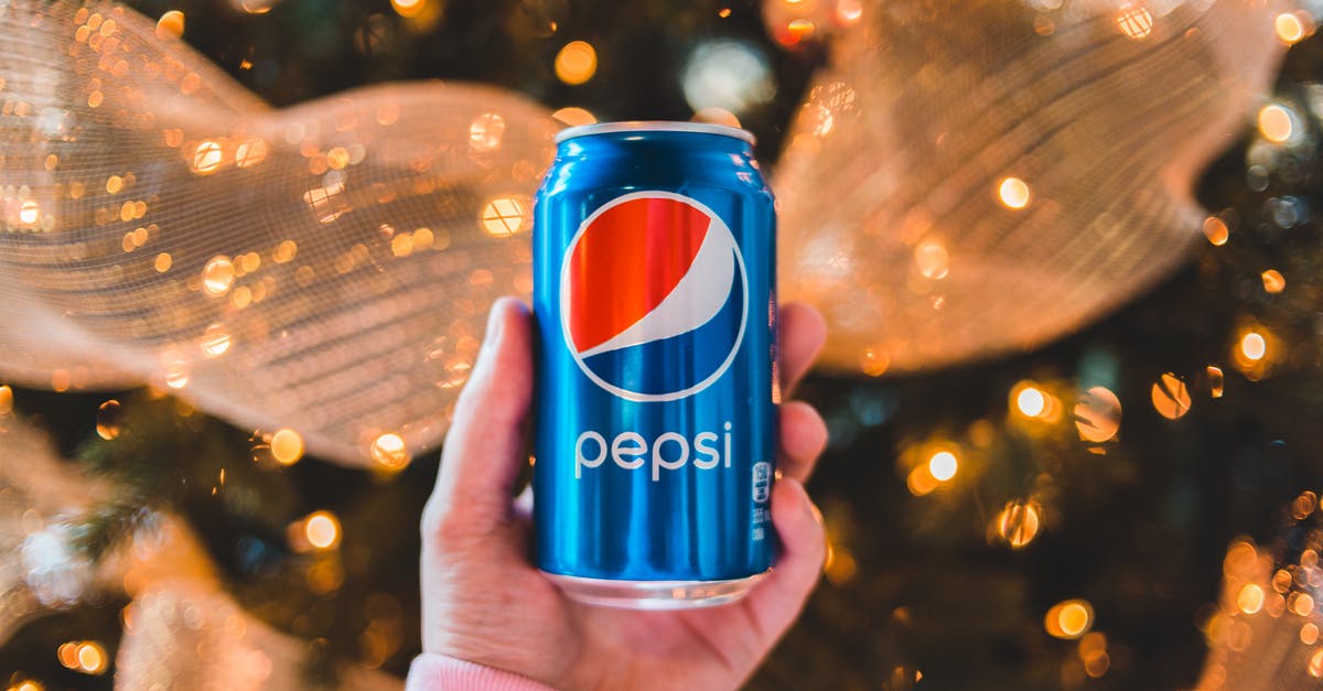 Can I appeal a UK refusal and 10-year ban? - Crop unrecognizable person showing colorful can of refreshing drink during New Year holiday