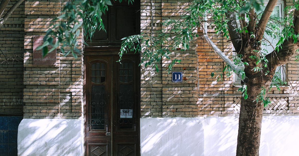 Can I be refused entry due to my place of birth? - Facade of classic residential house in city