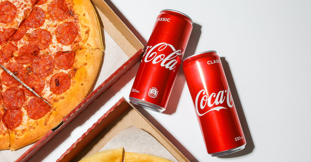 Can I bring a cheese plane in carry-on? [duplicate] - Coca Cola Cans Beside Pizza