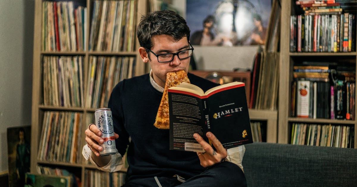 Can I bring an anti-religious book into Saudi Arabia? - A Man Eating Pizza Reading a Book of Hamlet