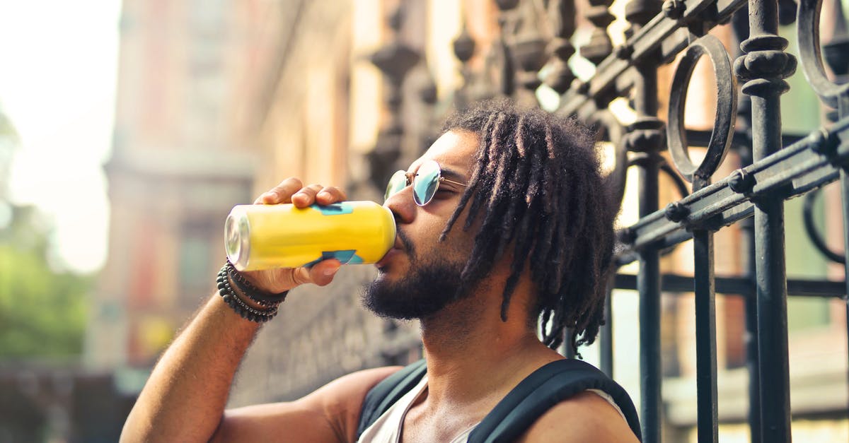 Can I bring an electric hair clipper in my hand luggage? - Photo of Man Drinking