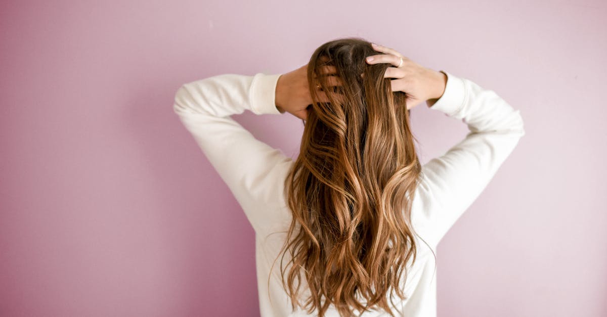 Can I bring an electric hair clipper in my hand luggage? - Woman Wearing White Long-sleeved Shirt