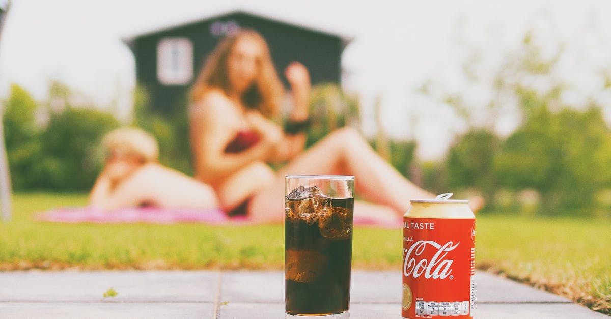 Can I bring glass goblets onboard? - Coca-cola Can and Drinking Glass Filled With Coke