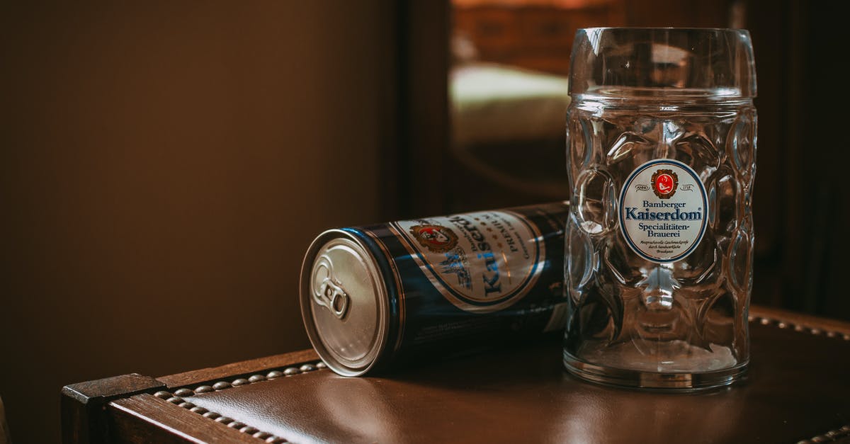 Can I bring glass goblets onboard? - Tin Can Near Clear Glass Mug