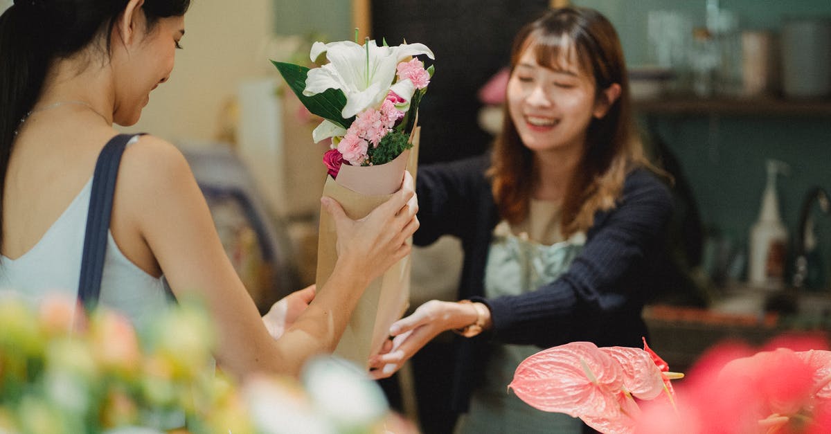 Can I buy Eurail pass offline? Are there any physical locations? - Happy Asian florist selling bouquet to female customer