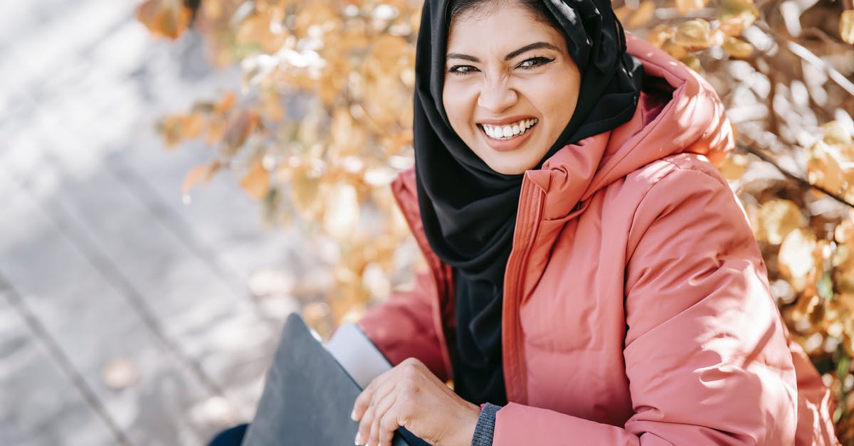 Can I communicate via an encrypted connection in United Arab Emirates? - Delightful ethnic woman with laptop in park