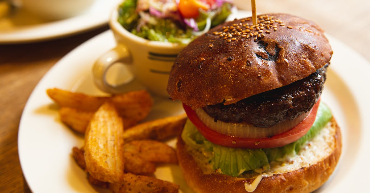 Can I eat a beef burger in India? - Delicious burger with vegetables and fries