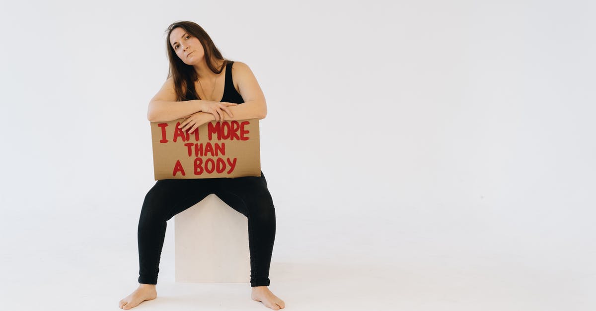 Can I enter Serbia if I am travelling with a wound? - A Woman Showing a Placard