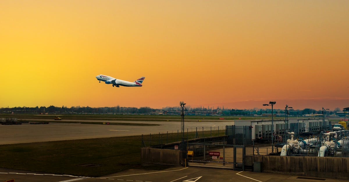 Can I exit the airport for my 7 hour layover in Paris? - White Airplane on Airport during Sunset