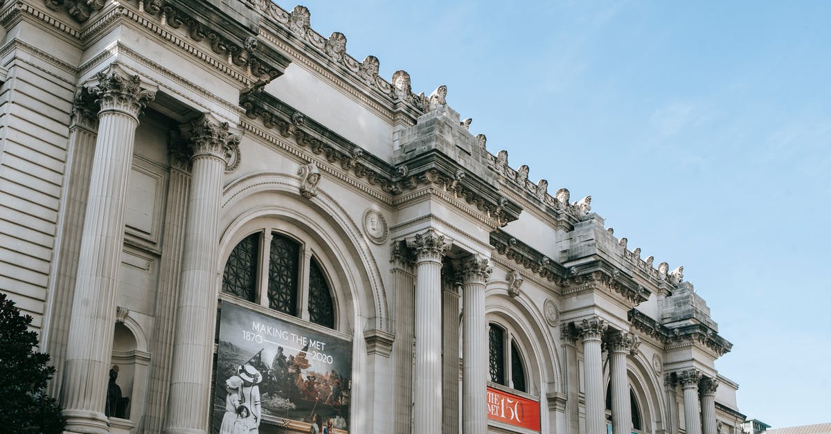 Can I find a museum pass in New York? - Facade of famous art museum with columns and sculptures