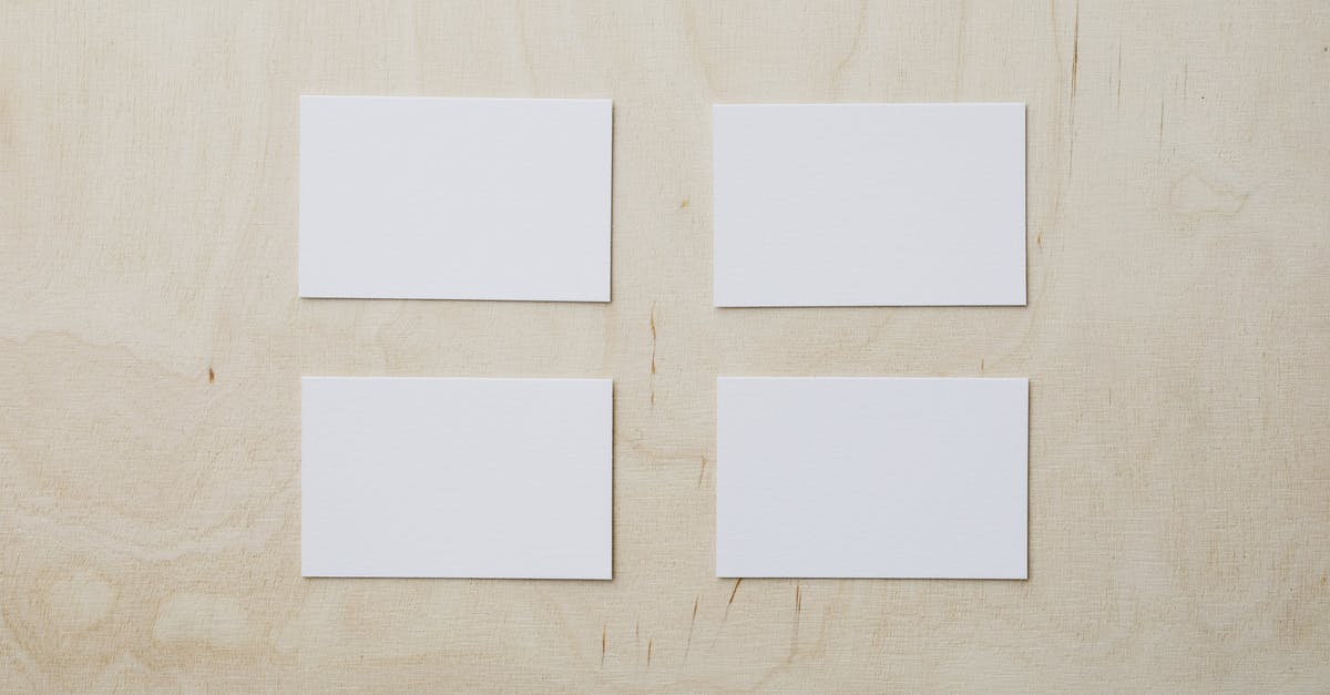 Can I get a NEXUS card with no intention of regularly traveling to or from Canada? - Overhead view of clean white mockup greeting cards placed on light brown wooden desk