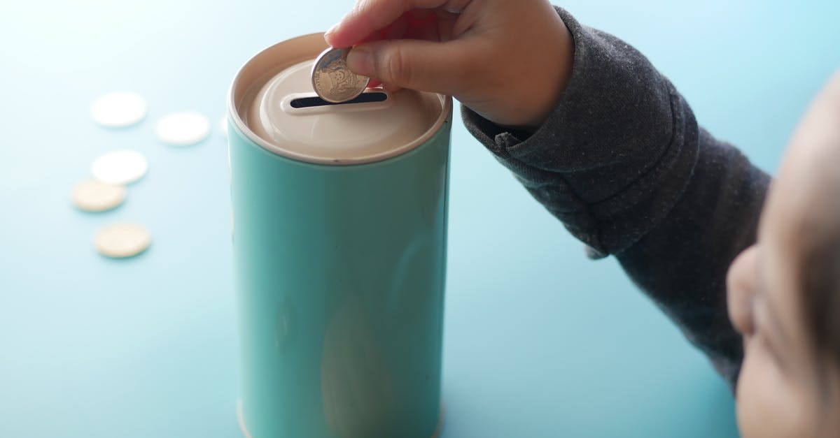 Can I get vaccinated in another country? - A Person Putting Money in a Can