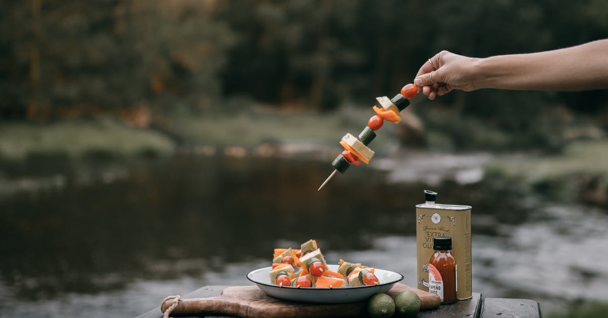 Can I get vegan sushi in Tokyo? - A Person Getting a Skewer with Vegetables