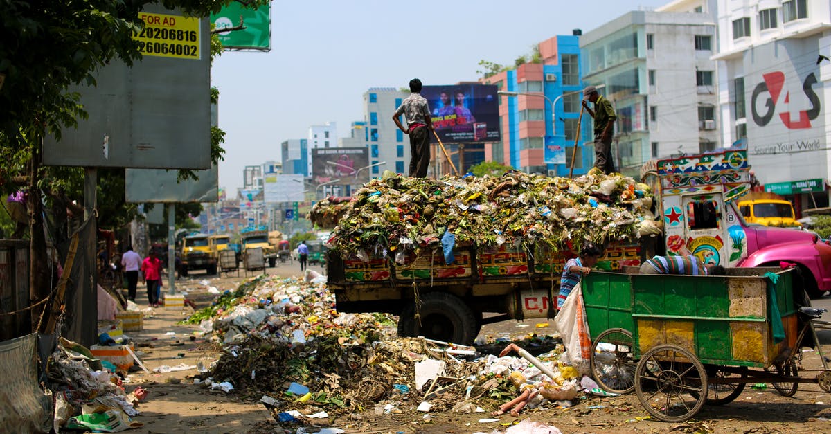 Can I import electronics from India to Bangladesh while traveling? - Photo of a Dump Truck Across Buildings